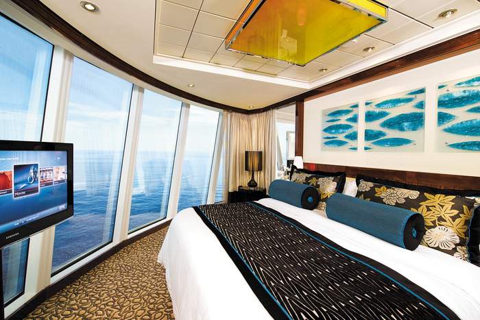 Norwegian Cruise Line Norwegian Epic Accommodation Deluxe Owners Suite Bedroom.jpg